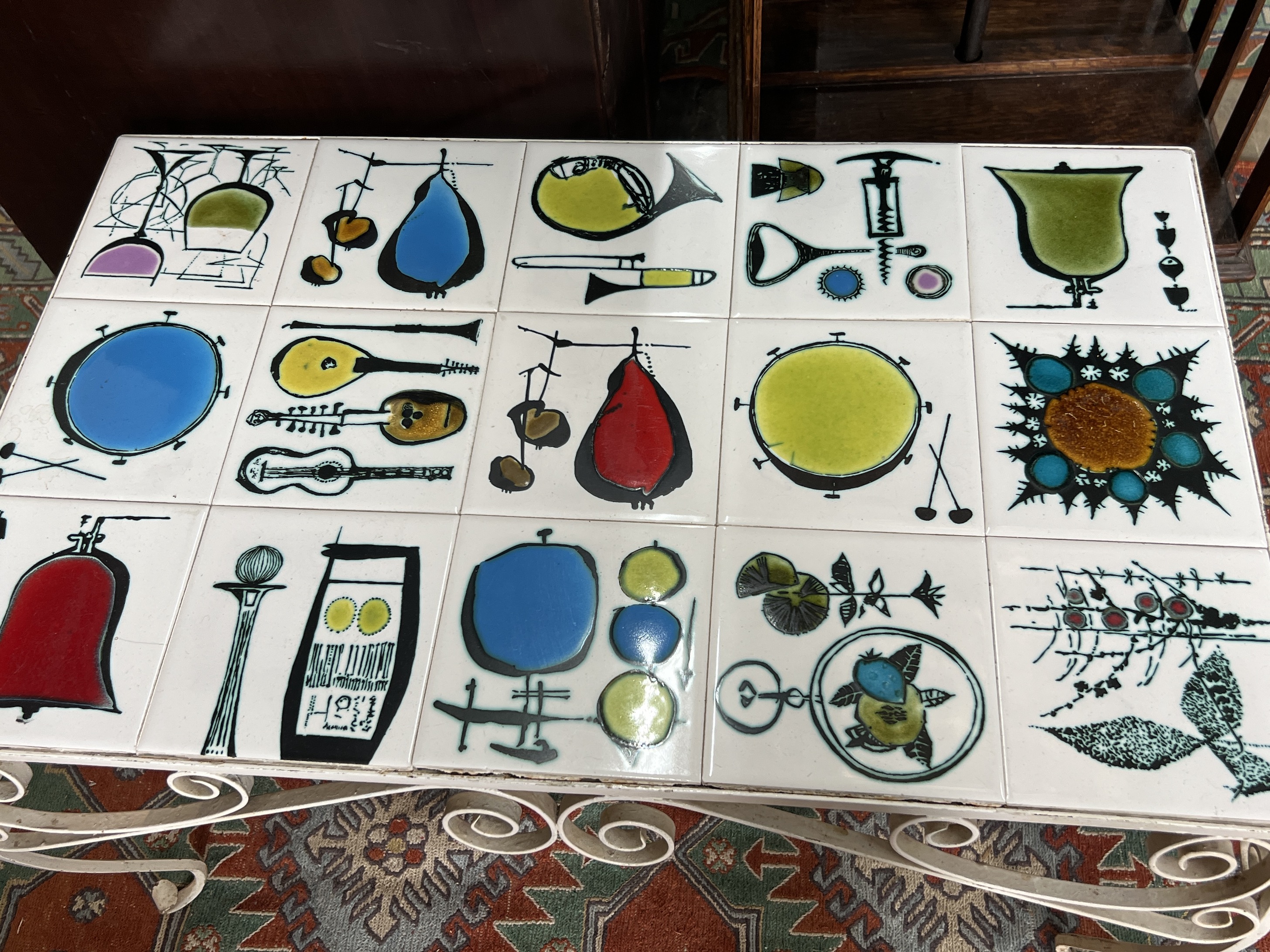 A mid century rectangular tile top wrought iron coffee table, width 79cm, depth 51cm, height 44cm